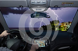 Driving while using navigation system towards lightning over the sea