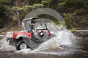 Driving UTV through water crossing