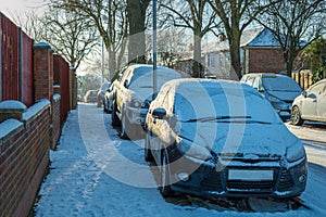 Driving on winter snow road in town in england uk during covid lockdown