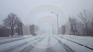 Driving Winter Snow Storm With Vehicle Traffic in Day.  Driver Point of View POV Snowing Blizzard Snowfall Weather Conditions