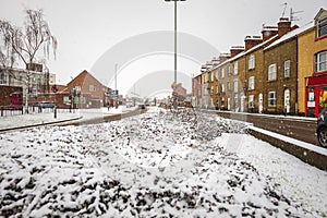 Driving in winter snow in town in england uk during covid lockdown