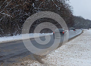 driving in winter after a snowfall, ice on the road, temperatures below zero