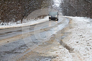 driving in winter after a snowfall, ice on the road, temperatures below zero