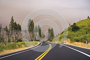 Driving through Yosemite National Park; sky covered by smoke