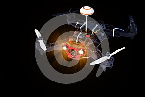Dron, quadro copter Isolated on black background, closeup. photo