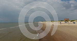 Drone aerial 4kview of the Baltic sea waves and beach shore in Ventspils