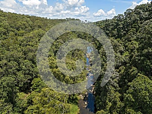 Drone aerial of Broken River flowing through dense national park