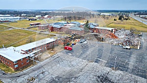 Drone aerial of construction site of deconstruction of old abandoned hospital building with decay at Byron Health Center