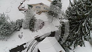Drone Aerial Flying above suburban houses in Villanova, PA suburban Philadelphia area in heavy snow