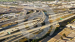 Drone Aerial Flying High Above a Busy Freeway Interchange on an Afternoon in the City