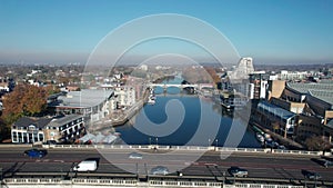 The drone aerial footage of Kingston bridge and kingston railway bridge over Thames river.