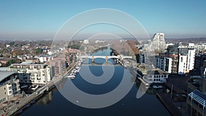 The drone aerial footage of Kingston bridge and kingston railway bridge over Thames river.