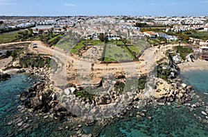 Drone aerial of holiday village with luxury houses at an idyllic rocky coast. Summer vacations at the sea. Protaras photo