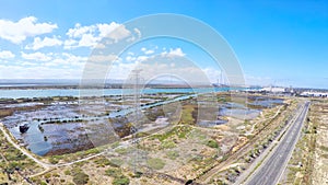 Drone aerial of industrial area high-voltage towers, taken at Port Adelaide.