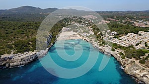 Drone aerial landscape of the beautiful bay of Cala Estany d`en Mas with a wonderful turquoise sea, Cala Romantica, Porto Cristo