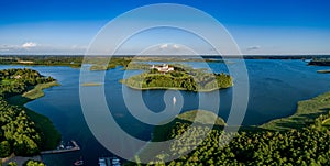 Drone aerial landscape photo - Camaldolese monastery complex and Wigry Lake, blue sky, sunny day, national park - summer in Poland