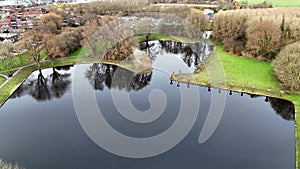 drone aerial movie of pond with pollarded willows