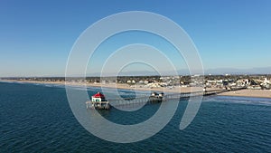 Drone Aerial Over Pacific Ocean at Huntington Beach California Circling the Pier