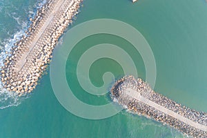 drone aerial overhead view of a harbor protection boardwalk