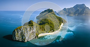 Drone Aerial Panorama image of Helicopter Island in the Bacuit Bay in El Nido, Palawan, Philippines lit by morning