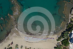 Drone aerial scenery of a sandy bay tropical beach for swimming. Summer vacations