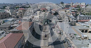 Drone aerial shot at the Clock Tower in Jaffa - Tel Aviv, Israel. Tourist monument at middle east city with coexist