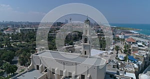 Drone aerial shot at the Clock Tower in Jaffa - Tel Aviv, Israel. Tourist monument at middle east city with coexist