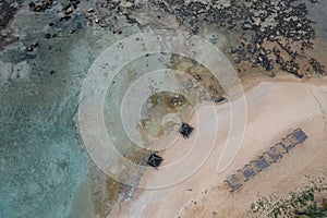 Drone aerial top view of empty tropical sandy beach in winter. limnara bay beach Ayia Napa Cyprus