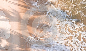 Drone aerial view beach waves at sunset photo