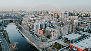 Drone aerial view of buildings and Dambovita River, Bucharest, Romania