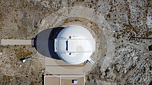 Drone aerial view of Calar Alto Observatory at the snowy mountain top in Almeria