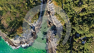 Drone aerial view of the cantabric sea coast. Cliff on the coast with turquoise sea on a sunny summer day