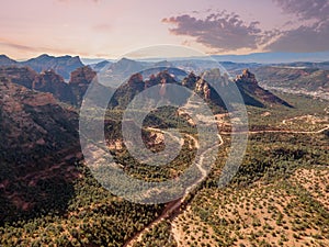 Drone Aerial View Of A Desert Landscape With A Curvy Road Running Through It In The American Southwest