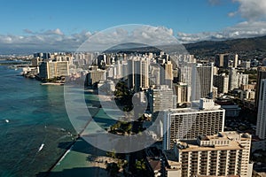 Drone, aerial view of downtown Honolulu with Waikiki Beach during sunrise