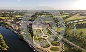 The drone aerial view of  Hampton court palace and garden along the Thames river.