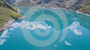 Drone aerial view of the Lake Barbellino an alpine artificial lake and the mountain around it. Italian Alps. Italy