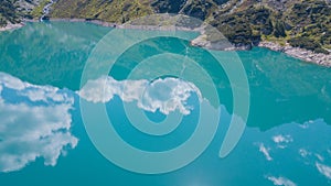 Drone aerial view of the Lake Barbellino an alpine artificial lake and the mountain around it. Italian Alps. Italy