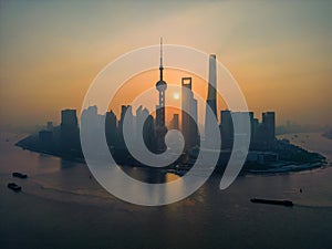 The drone aerial view of Lujiazui financial and trade zone at sunrise.