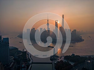 The drone aerial view of Lujiazui financial and trade zone at sunrise.