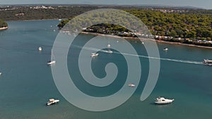 Drone aerial view of Mediterranean sea view with boats in a bay