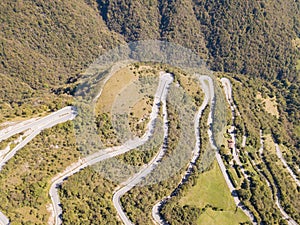 Drone aerial view of the mountain road in Italy. Bends creating beautiful shapes