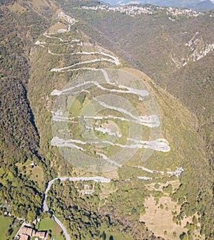 Drone aerial view of the mountain road in Italy from the village of Nembro to Selvino