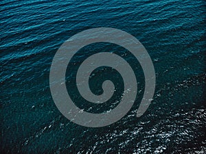 Drone aerial view of ocean waves. Blue water background