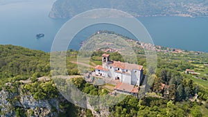 Drone aerial view of the Sanctuary of the Madonna della Ceriola on the top of the Monte Isola island