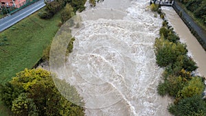 Drone aerial view of the Serio river swollen after heavy rains. Province of Bergamo, northern Italy photo