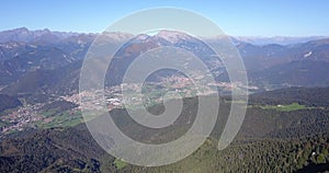 Drone aerial view to the Seriana valley and Orobie Alps in a clear and blue day