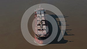 Drone Aerial wide above shot of cargo Bulk carrier ship cruising.