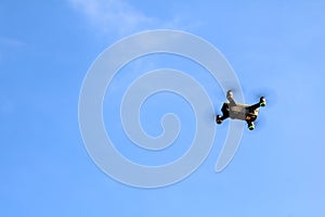Drone camera or UAV flying in the blue sky