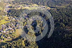 Winding Road and Country Houses Between Dense Forests, Zakopane Region, Poland â Aerial Perspective