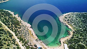 Drone captures bay, turquoise waters at Maiden Hamam. Aerial view of bay, turquoise and rocky cliffs. Explore bay